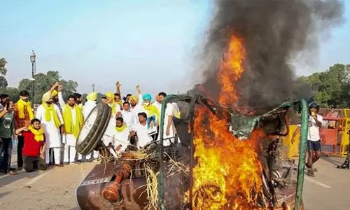 Four more arrested in tractor burning case