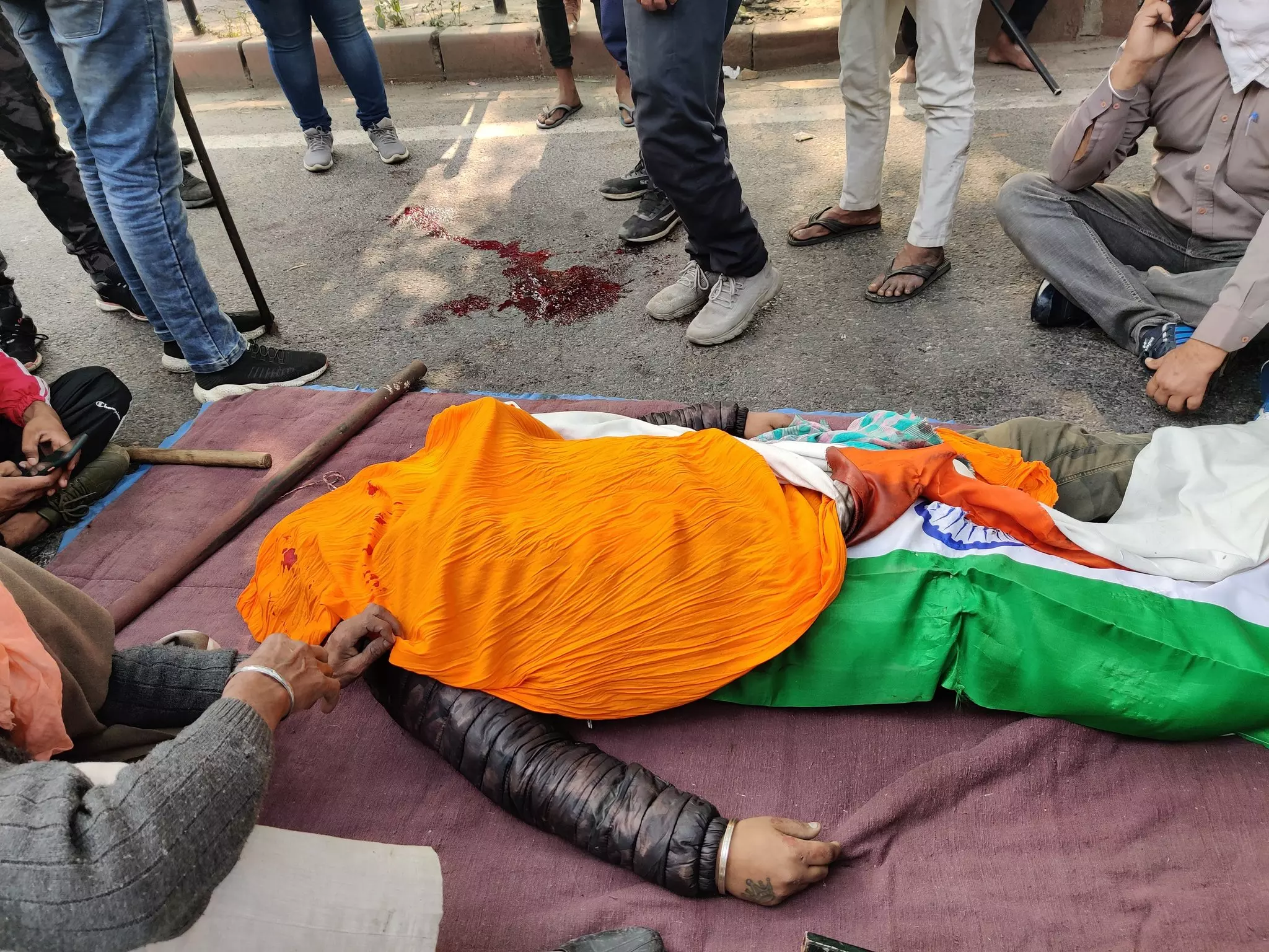 Farmers claims that a bullet has hit a farmer driving a tractor