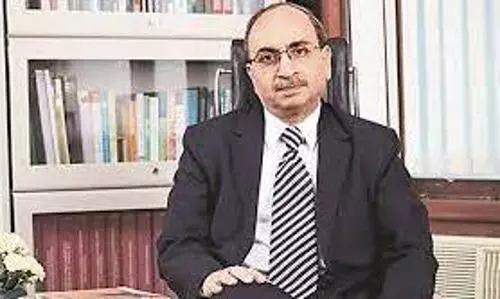 Trying to keep soft interest rate regime intact to back economy: SBI chief