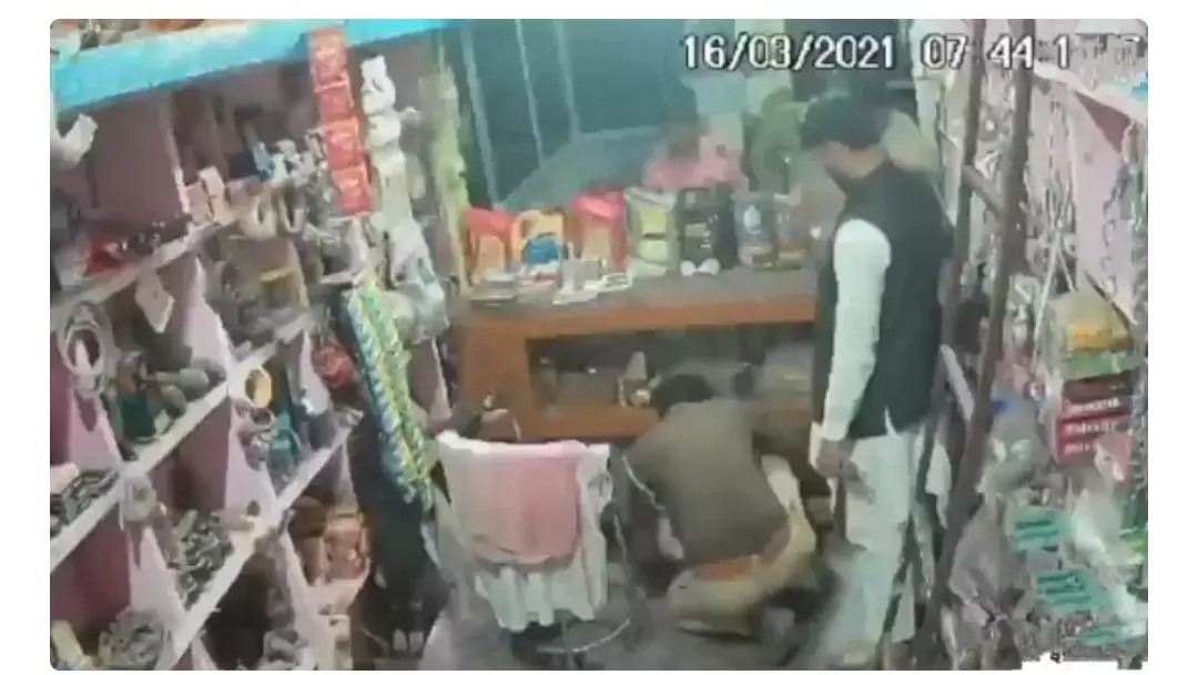 UP cop caught on camera planting firearm in Muslim vendors shop