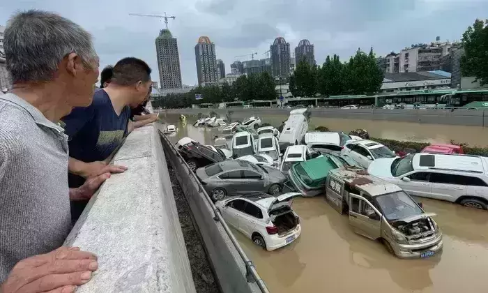 Death toll climbs in China floods, Infrastructure takes a massive hit