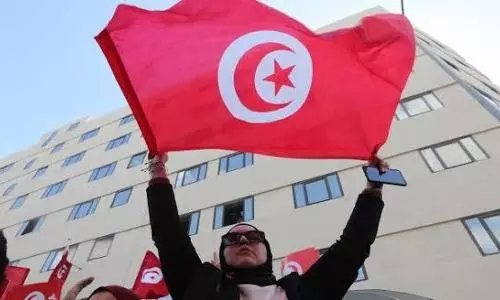 Critics accuse Tunisian President of coup after sacking PM and freezing parliament