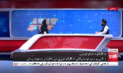 TOLO News female television anchor interviews a Taliban official on camera