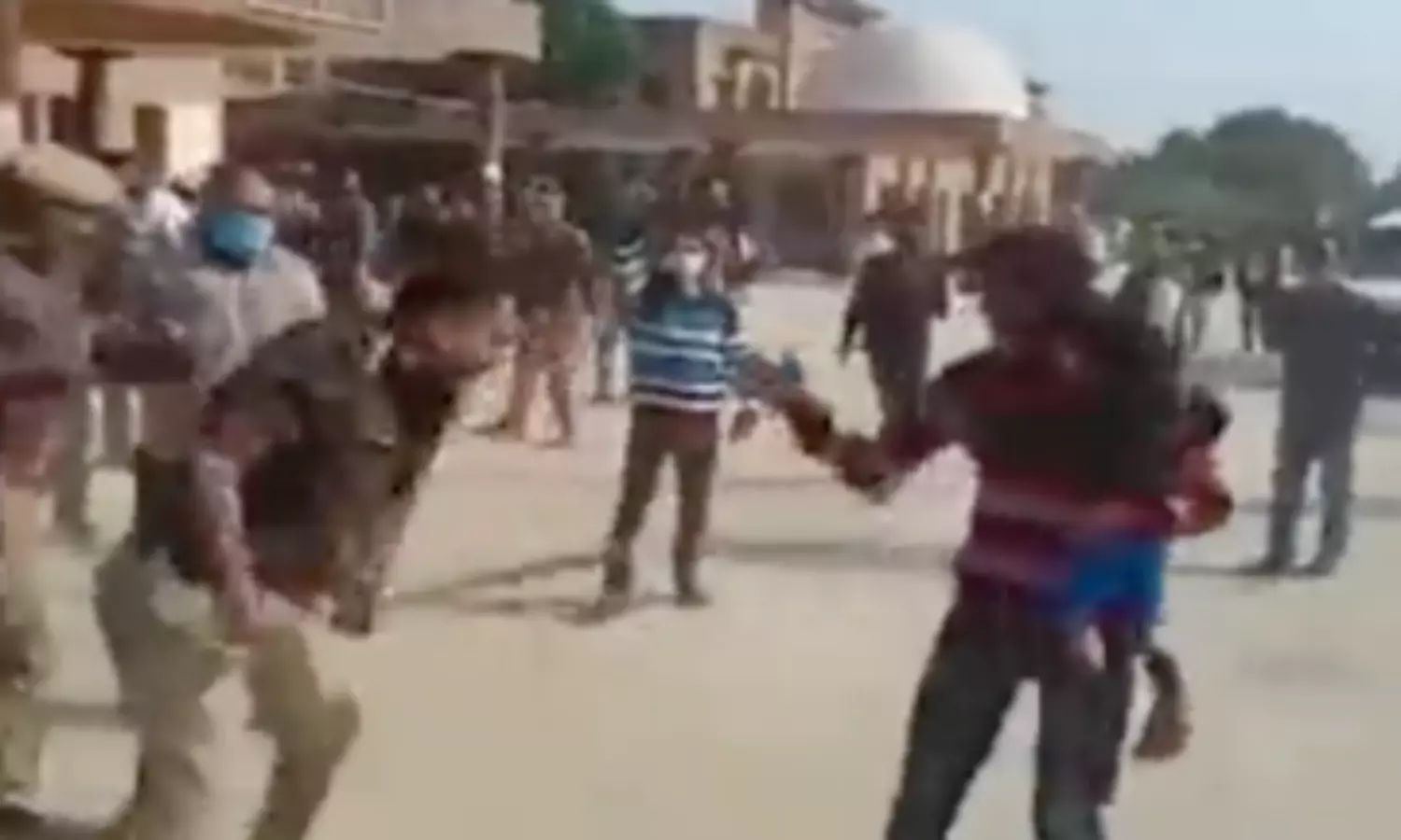 UP police order probe into video of man with child being thrashed by police officer