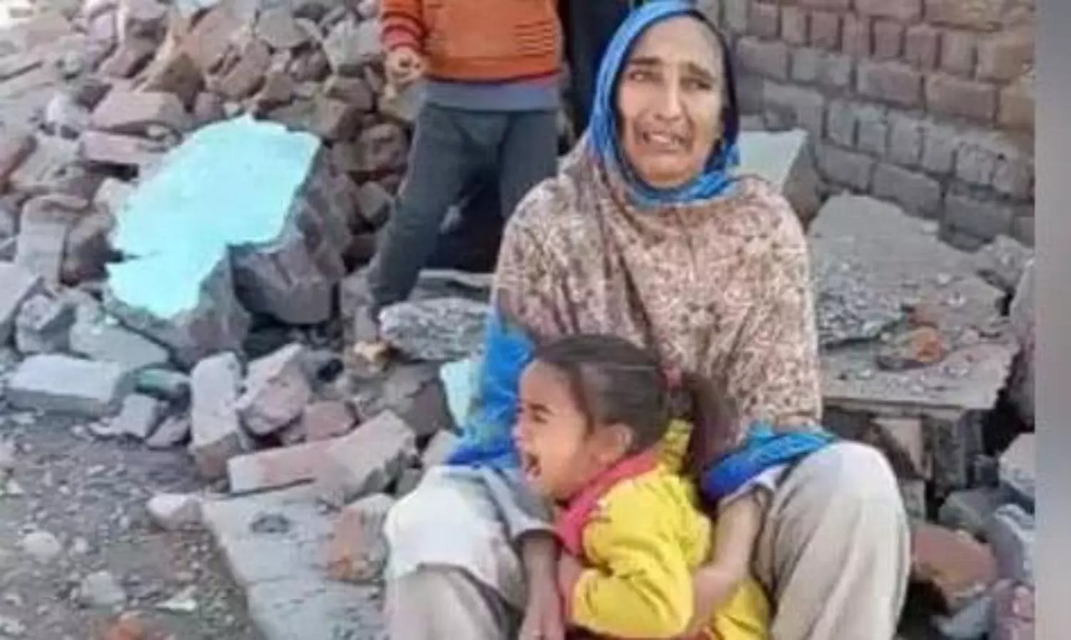 Tribal families in Srinagar protest the demolition of their homes