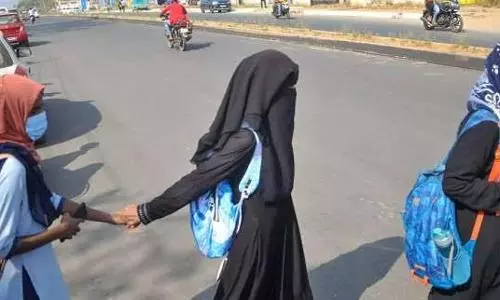 Karnataka bans hijab, saffron scarves in state-run minority institutes