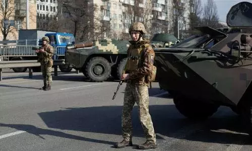 Putin signs law that would jail journalists over fake news on Russian army