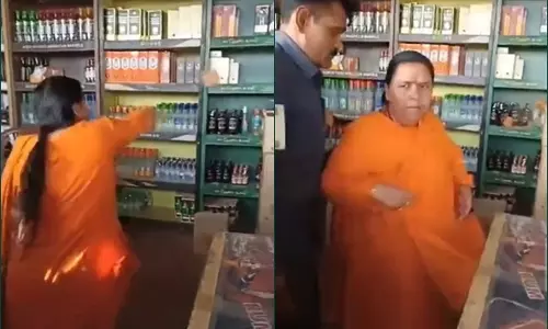 BJP leader Uma Bharti vandalises liquor store in MP
