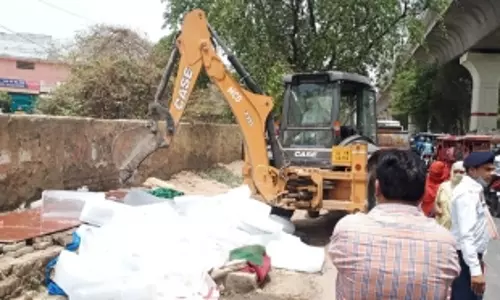 Bulldozers roll near Rithala metro station in Delhi