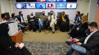 Afghan male TV presenters wear masks in support of their female counterparts Afghan male TV presenters wear masks in support of their female counterparts