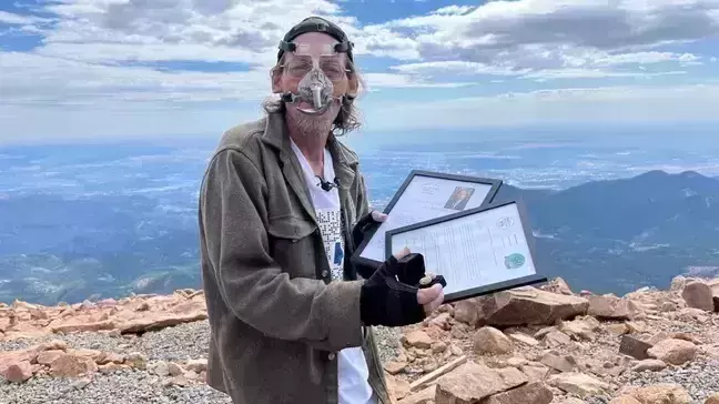 US man sets record for pushing peanut up a mountain with his nose