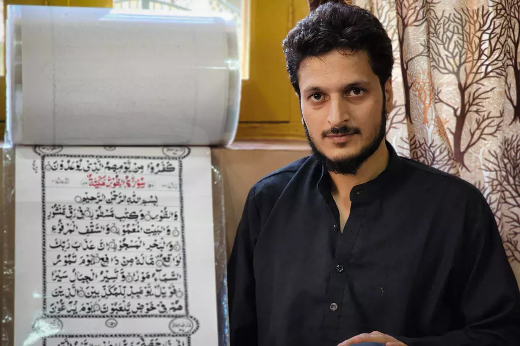 This Kashmiri man takes 3 months to write Holy Quran on a 500-metre scroll