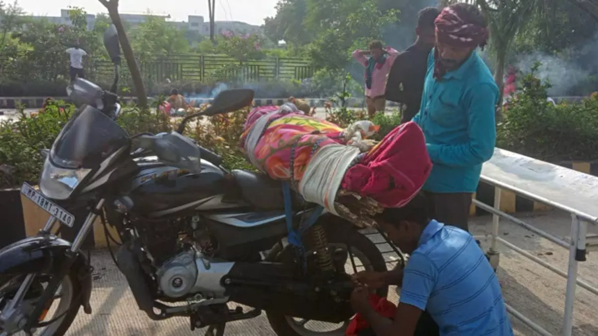 Hospital denies hearse, MP man carries mothers body on bike Hospital denies hearse, MP man carries mothers body on bike