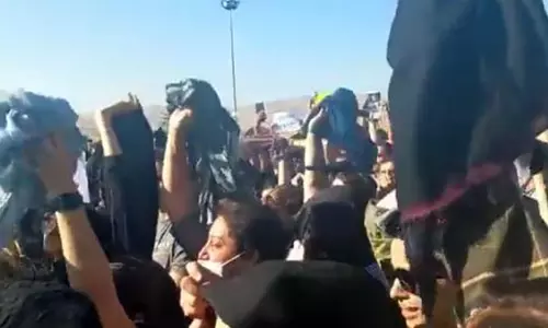 Iranian women take off hijab, protest Aminis death after morality police arrested her
