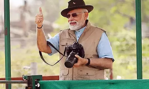 Nikon camera with Canon cover: BJP attacks TMCs morphed pic of Modi