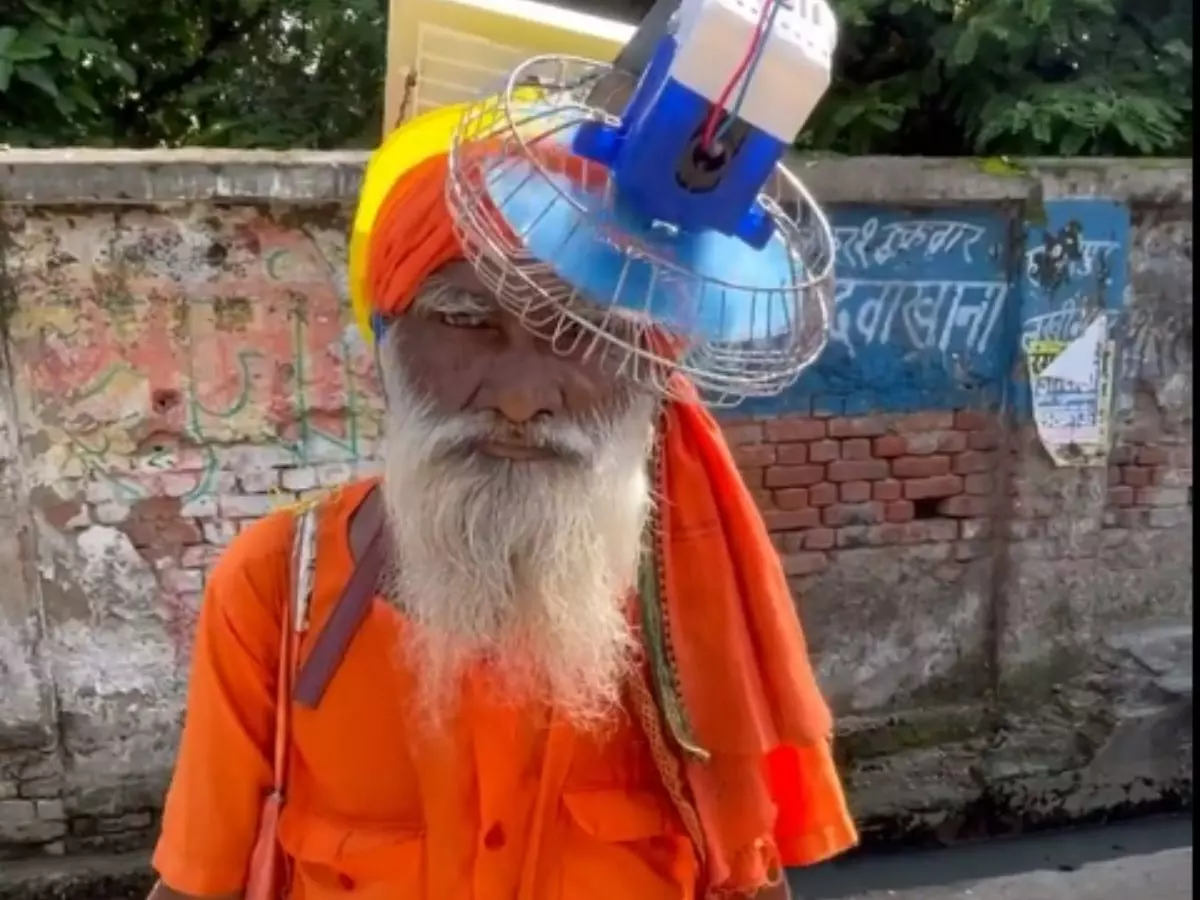UP man finds a stunning idea to beat heat, a head fan! UP man finds a stunning idea to beat heat, a head fan!