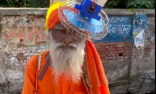 UP man finds a stunning idea to beat heat, a head fan!