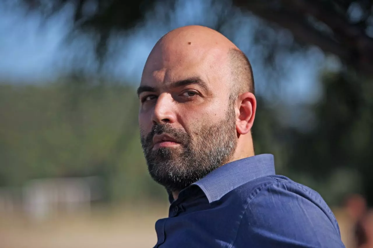Writer Roberto Saviano faces trial for cussing out Italian PM