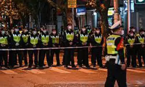 BBC Journalist covering protest in China dragged, kicked, cuffed