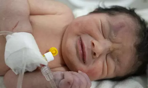 Baby born under rubble of her home in Syria rushed to hospital