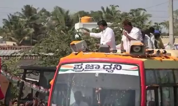 Cong leader Shivakumar flings Rs 500 notes during roadshow, BJP says people are not beggars Cong leader Shivakumar flings Rs 500 notes during roadshow, BJP says people are not beggars