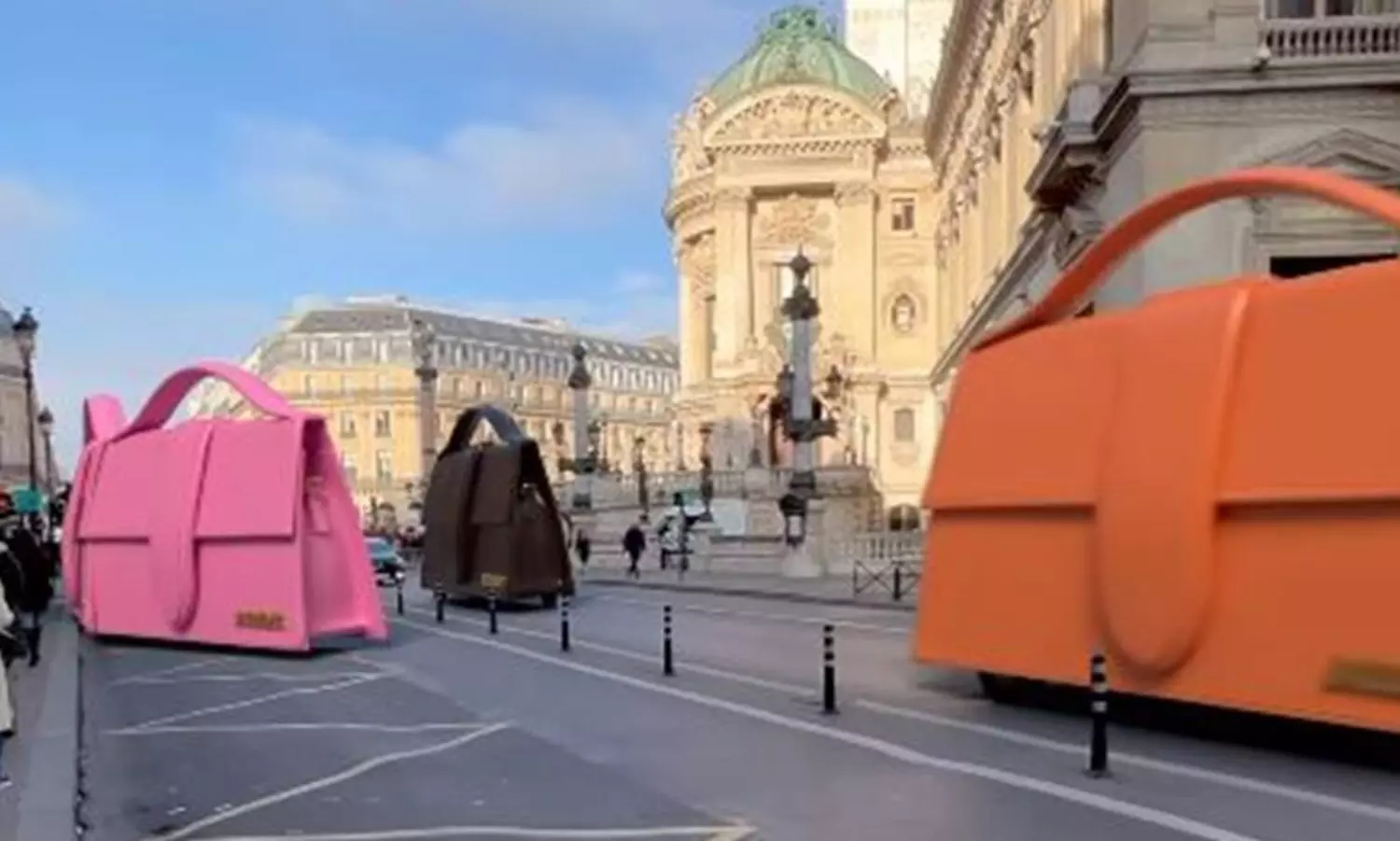 These giant Jacquemus handbags zipping through the streets of Paris have passengers inside