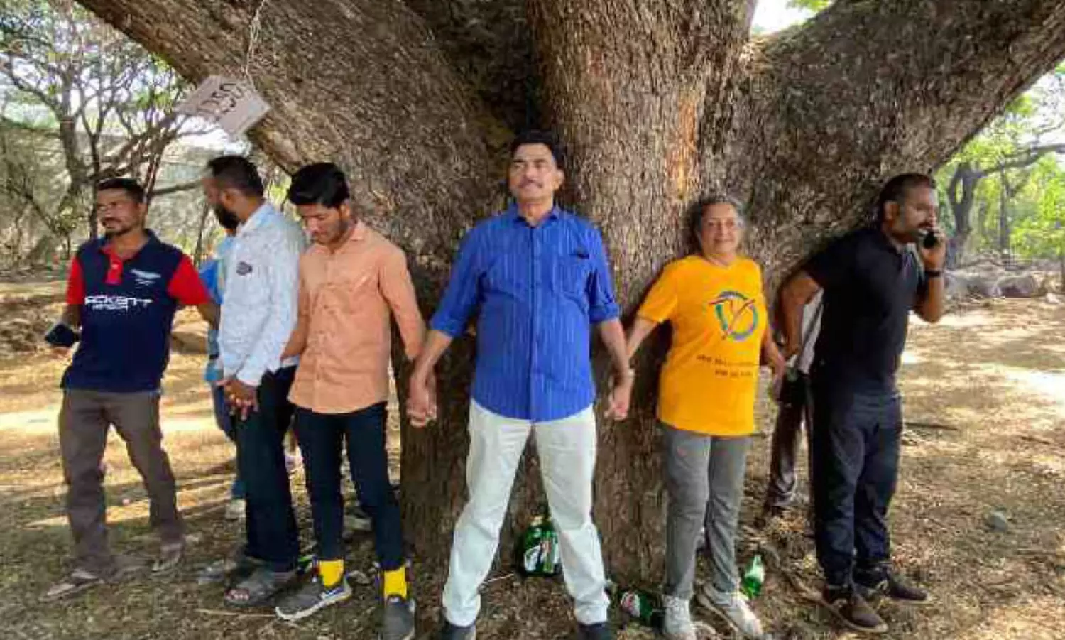 Activists stage ‘Chipko’ protest in Pune against felling of trees for a river project: report