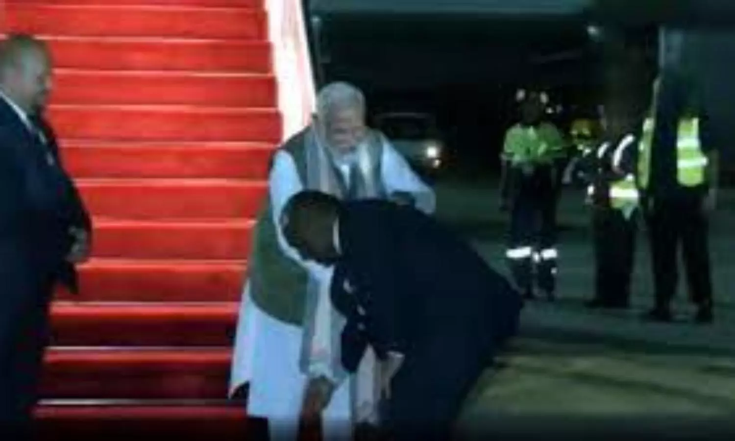 Papua New Guinea’s PM touches Modi’s feet welcoming him unusually after sunset