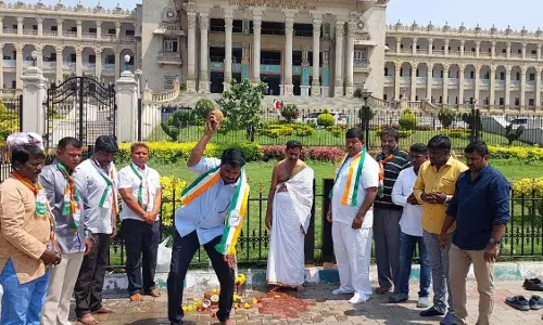 Congress workers purify Ktaka Vidhana Soudha with cow urine as corrupt BJP rule ends