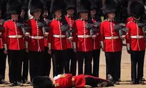 British soldiers attending parade in scorching heat faint in front Prince William