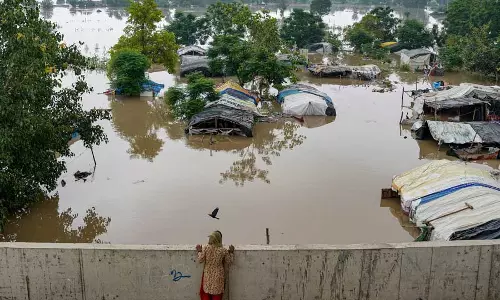 Yamuna flows at unprecedented levels, overflows onto Delhis streets
