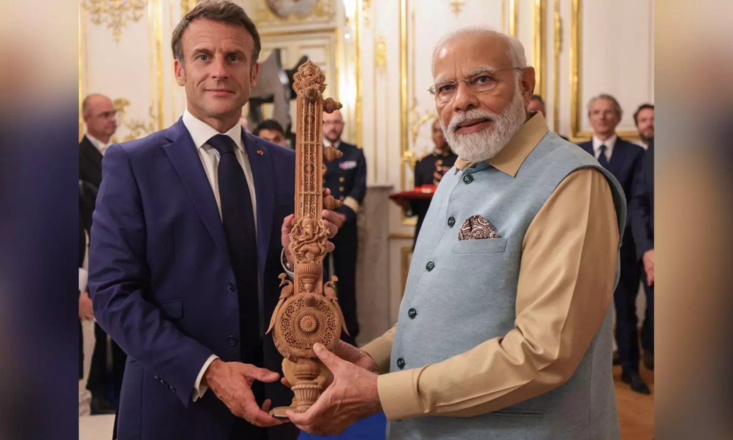 PM Modi gifts sitar to French President Macron, silk to his wife