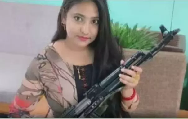 Ex-TMC leader’s wife seen holding AK-47 rifle as anniversary gift, leader claims its a toy gun after backlash