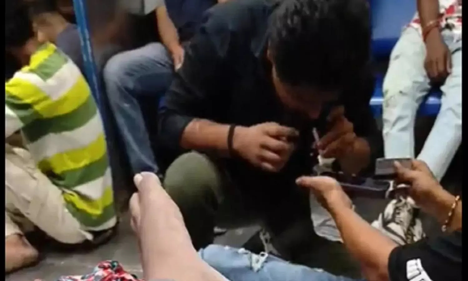 Man snorting drugs on Mumbai local in viral video; Railway responds