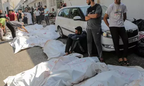 Gazan rebury bodies exhumed from cemetery
