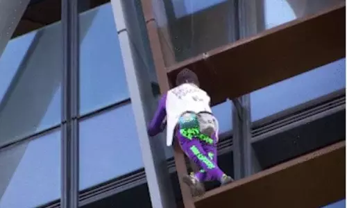 French climber scales Paris skyscraper in call for peace amid Israel-Hamas conflict