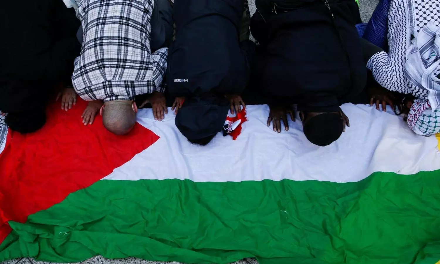 Pro-Palestine protester draped in Palestine flag sets herself ablaze outside Israel consulate in US