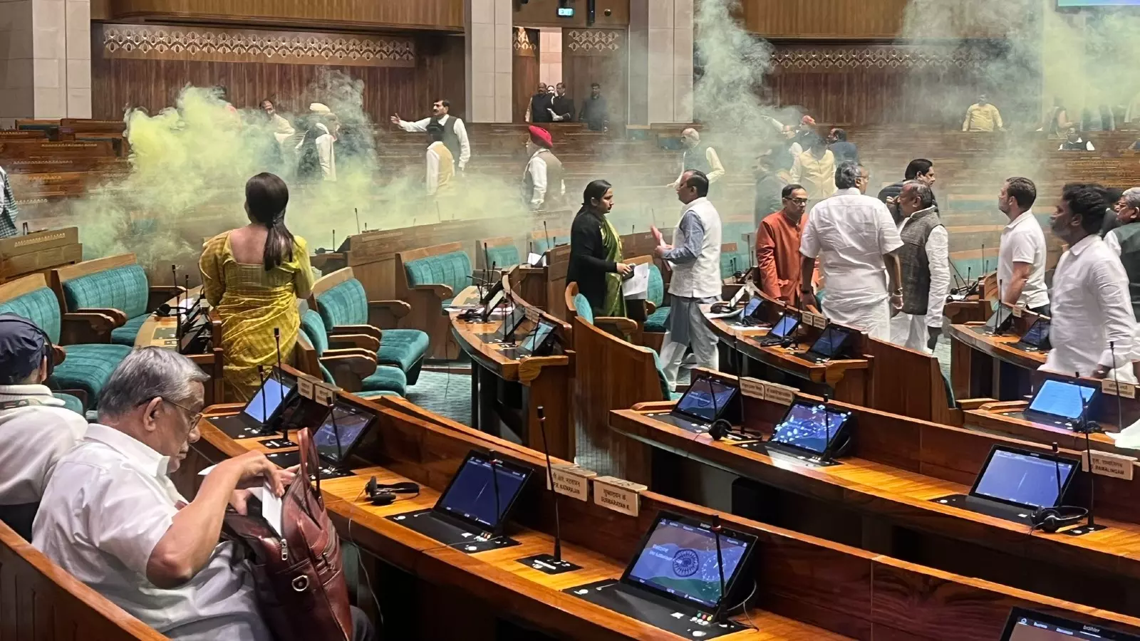 Two men enter Lok Sabha, shouting slogans against dictatorship; spray yellow smoke