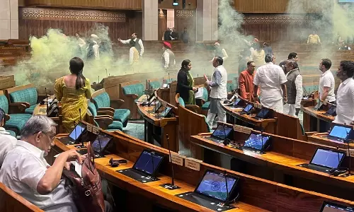 Two men enter Lok Sabha, shouting slogans against dictatorship; spray yellow smoke