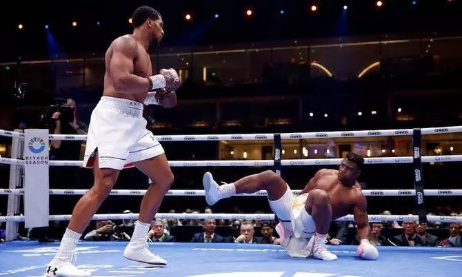 Anthony Joshua knocks out MMA star Francis Ngannou in one-sided boxing match