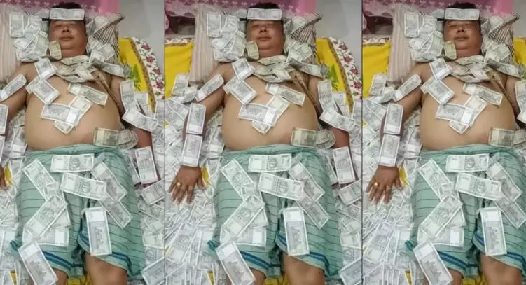 EDs eyes yet to reach BJP allys member sleeping semi-nude on pile of Rs 500 notes EDs eyes yet to reach BJP allys member sleeping semi-nude on pile of Rs 500 notes