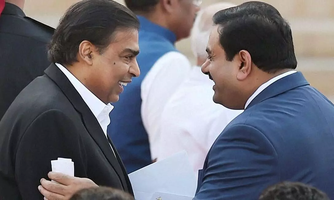 Giants collaborate: Reliance picks stake in Adani project