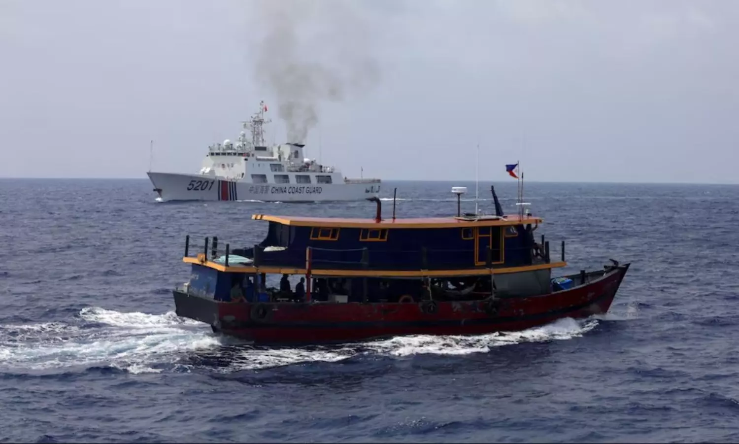 China runs combat patrol in disputed sea where US perform exercise