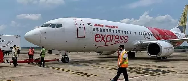 Irate Kerala passengers protest last minute AI Express cancellation