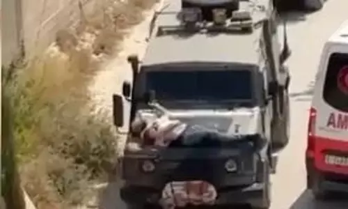 Torture!! Israel troops bind man to military jeeps bonnet