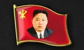 Cult development?? N Korean officials wear Kim Jong Un-face badges
