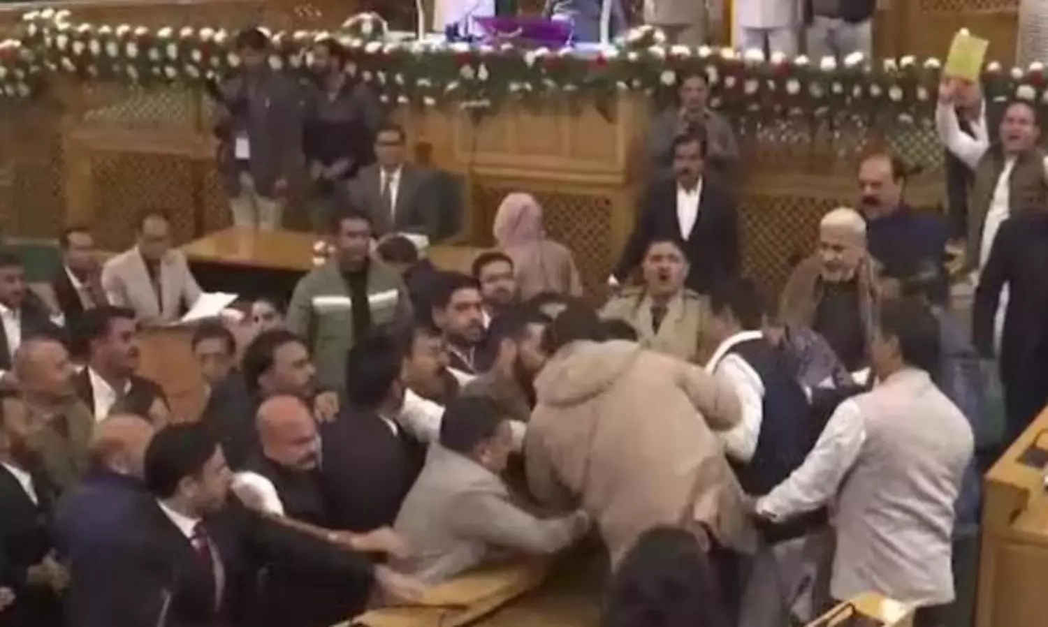 Chaos in J&K Assembly as a member shows Article 370 banner