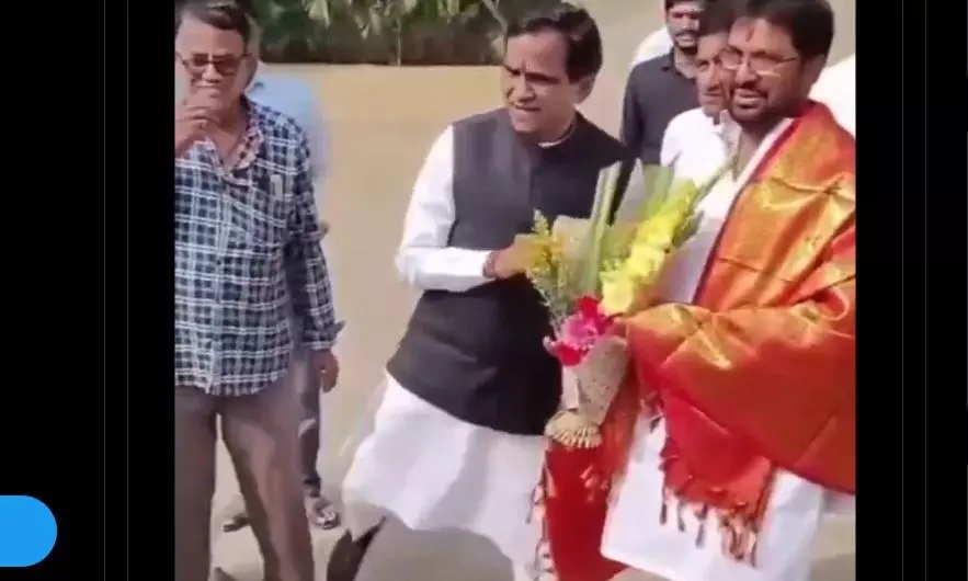 Video: BJP leader kicks party worker for interrupting a photo session!