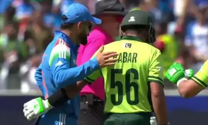 Champions Trophy: Kohlis friendly pat of Babar makes pic of the day