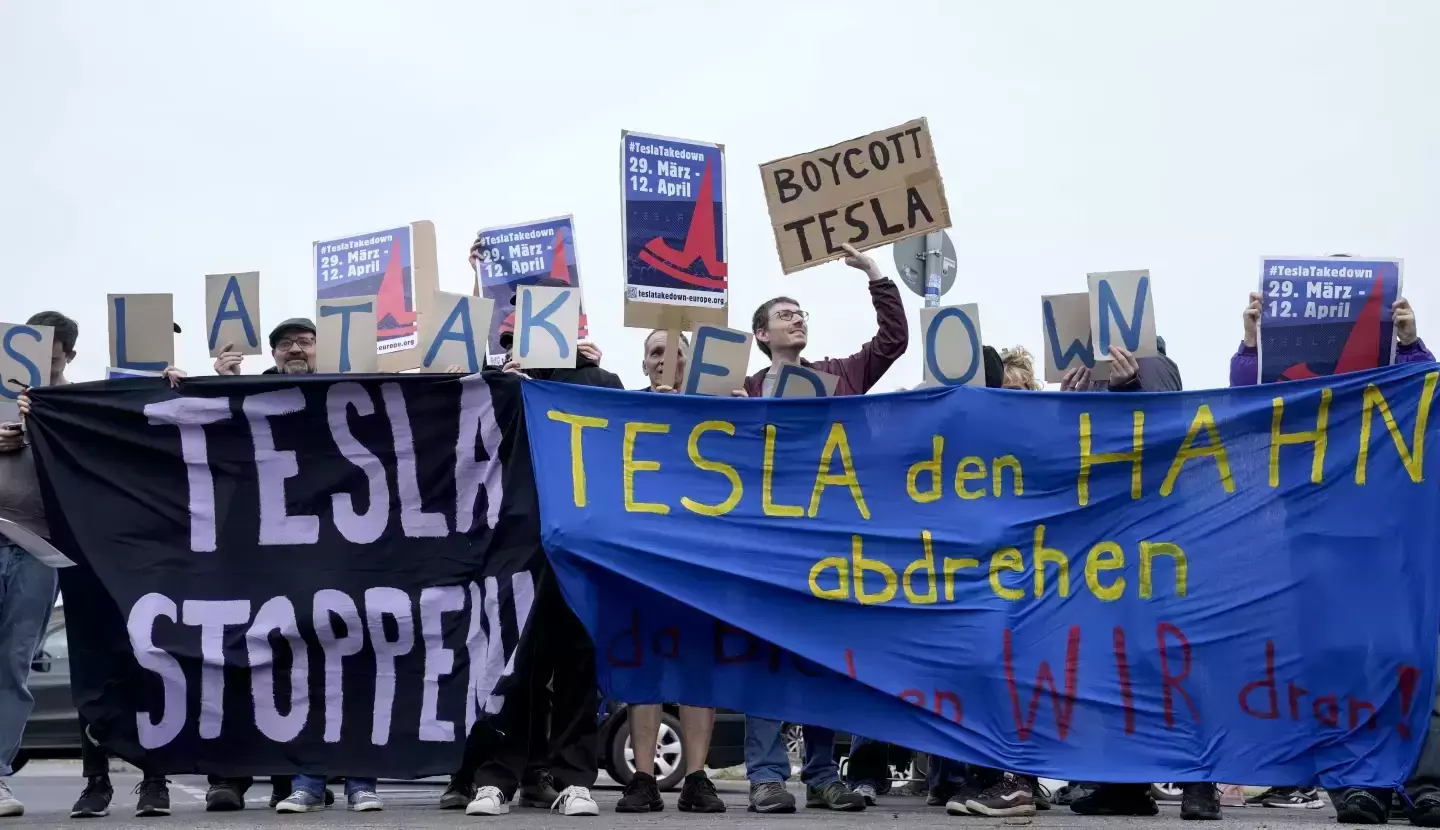 Protesters attend the Tesla Takedown Global Day of Action in front of a Tesla dealership, in Berlin, Saturday, March 29, 2025.Photo | AP